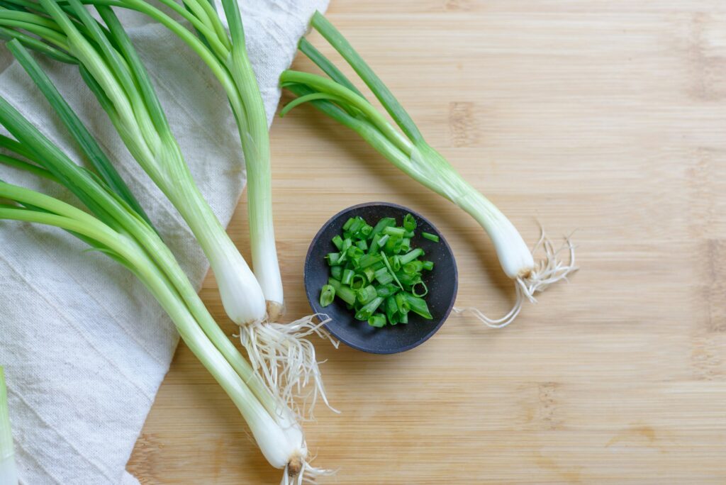 Scallion on wooden table